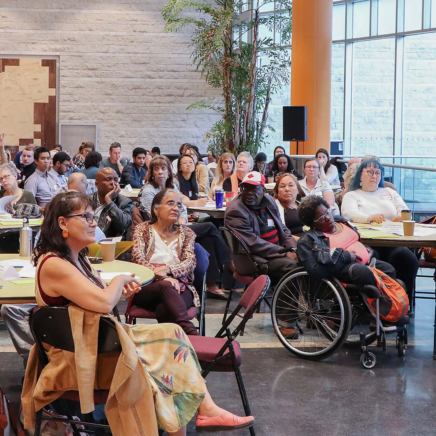 Diverse group of people listening to a presentation