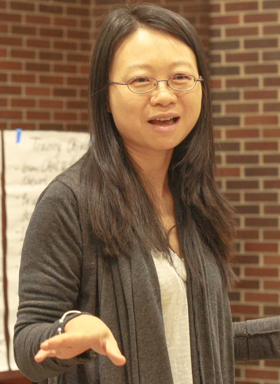 Woman presenting at a conference